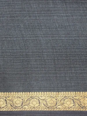 Close-up of floral vine prints and gold zari border on slate blue Tussar silk saree