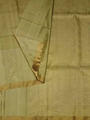 Close-up of floral zari buttas and golden tissue border on Olive Green Soft Silk Saree