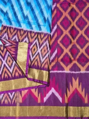 Close-up of magenta Ikat patterns and golden tissue border on Blue Pochampally Silk Cotton Saree