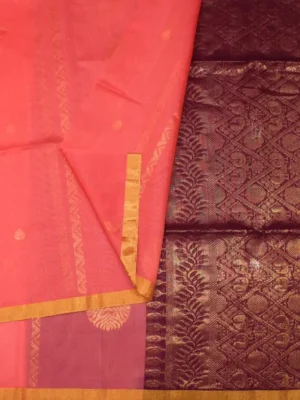 Close-up of Neli zari patterns, Thilagam buttas and golden tissue border on Coral Pink Pure Silk Cotton Saree