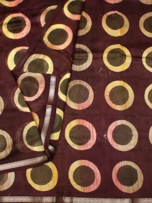 Close-up of abstract circular print and self geometric woven border on Deep Maroon Pure Chanderi Cotton Saree