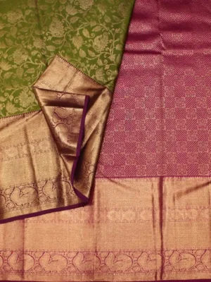 Close-up of peacock gold zari motifs and magenta contrast border on Emerald Green Bridal Soft Silk Saree