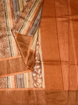 Close-up of floral and striped print with copper brown border on Honey Gold Pure Tussar Silk Saree