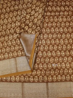 Close-up of traditional floral butta print and copper brown woven border on Rust Brown Pure Chanderi Cotton Saree