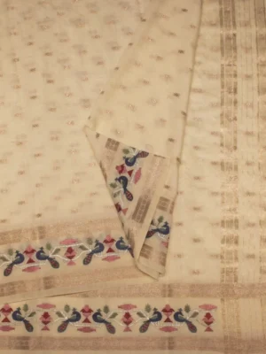 Close-up of zari buttas and colourful peacock floral motifs on Ivory Cream Assam Silk Saree