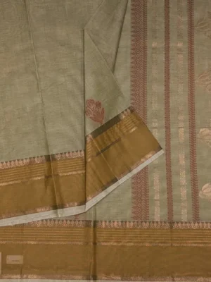 Close-up of floral threadwork, golden zari and Thilagam Neli border on Pista Green Kovai Cotton Saree