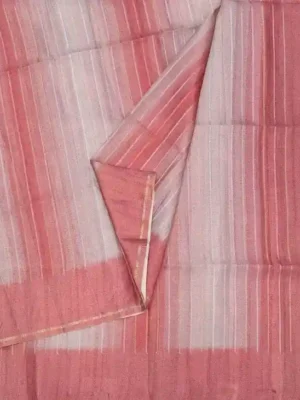 Close-up of coral pink and cream gradient stripes on Semi Tussar Saree