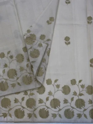 Close-up of golden-beige floral appliqué work on Ivory Kota Checks Saree