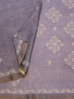 Close-up of floral appliqué border and zari-like edging on lavender Kora Checks Saree