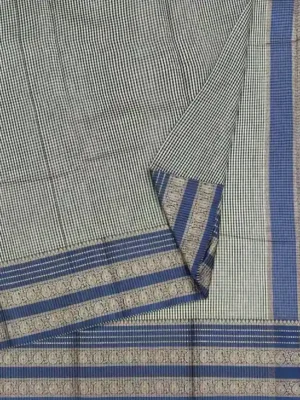 Close-up of micro-check weave and royal blue contrast border on Off White Semi Chanderi Saree