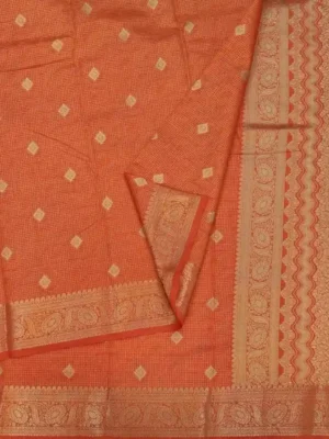 Close-up of golden zari diamond buttas and ornate woven pallu on Rust Orange Semi Tussar Saree