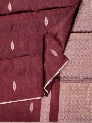 Close-up of antique gold zari leaf buttas and minimalist border on Wine Maroon Semi Tussar Saree