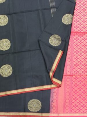Close-up of gold zari chakram buttas and Rani pink floral diamond lattice pallu on Jet Black Soft Silk Saree