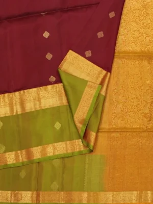 Close-up of Maroon Soft Silk Saree with Geometric Zari Buttas and Olive Green Border