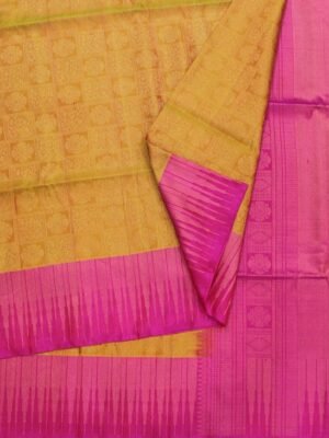 Close-up of geometric Jacquard checks, Rani pink temple border and gold zari brocade pallu on Mustard Yellow Soft Silk Saree