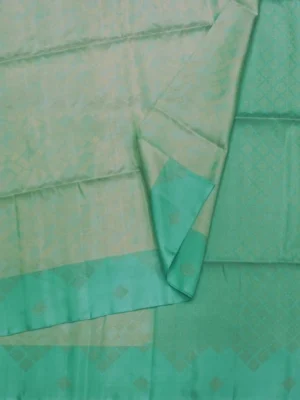 Close-up of golden zari geometric box patterns and diamond-design border on Pastel Sea Green Soft Silk Saree