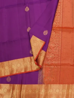 Close-up of gold zari floral buttas, orange peacock Jacquard border and richly woven pallu on Rich Purple Soft Silk Saree